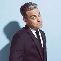Поп-дайджест: Oasis, слияние Warner Bros. и Paramount и инцидент с микрофоном Robbie Williams